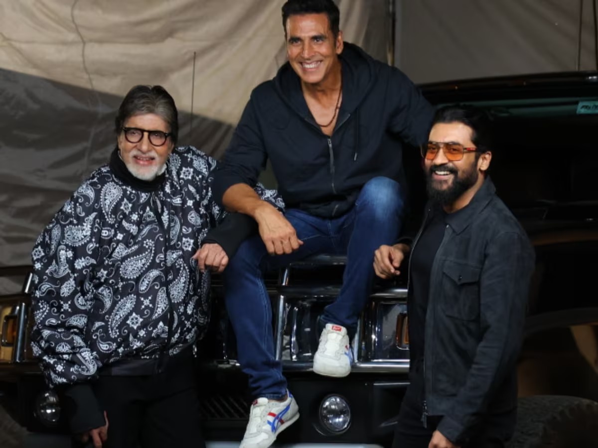 Amitabh Bachchan poses with Akshay, Suriya, and a cricket bat following hand surgery.