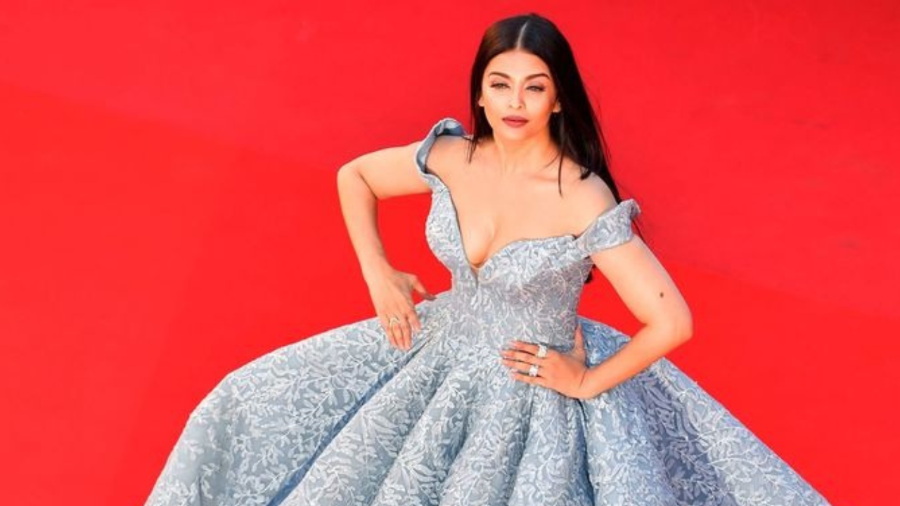 Aishwarya Rai looks lovely as she prepares in a dressing robe for the Cannes Film Festival. See pictures.